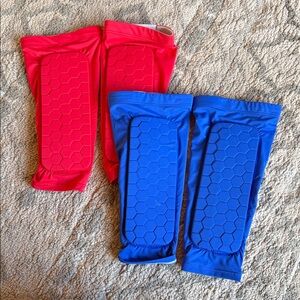 Red and Blue defender shin guards and
